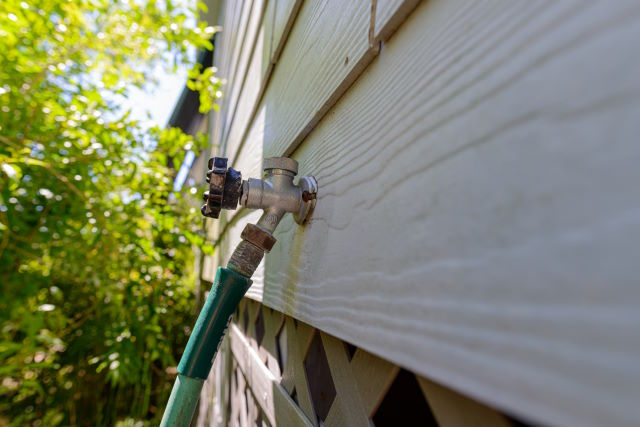 hose connected to outdoor spigot