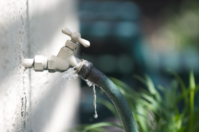 Outdoor faucet with hose